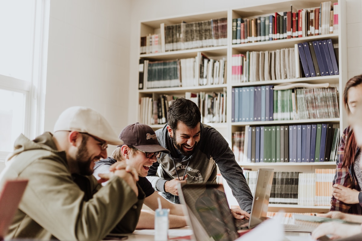 Cohort participants working on laptops during an AI marketing session